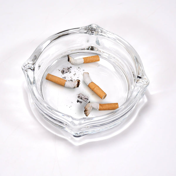 Crystal glass ashtray for cigars and cigarettes.